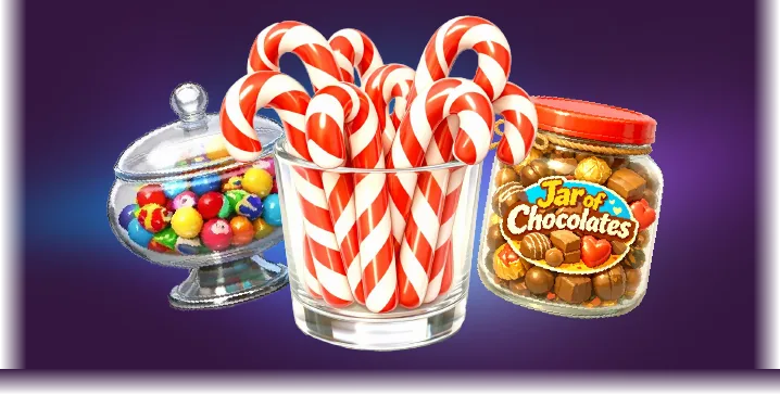 Candy canes in a glass, a bowl of gumballs and a jar of chocolates